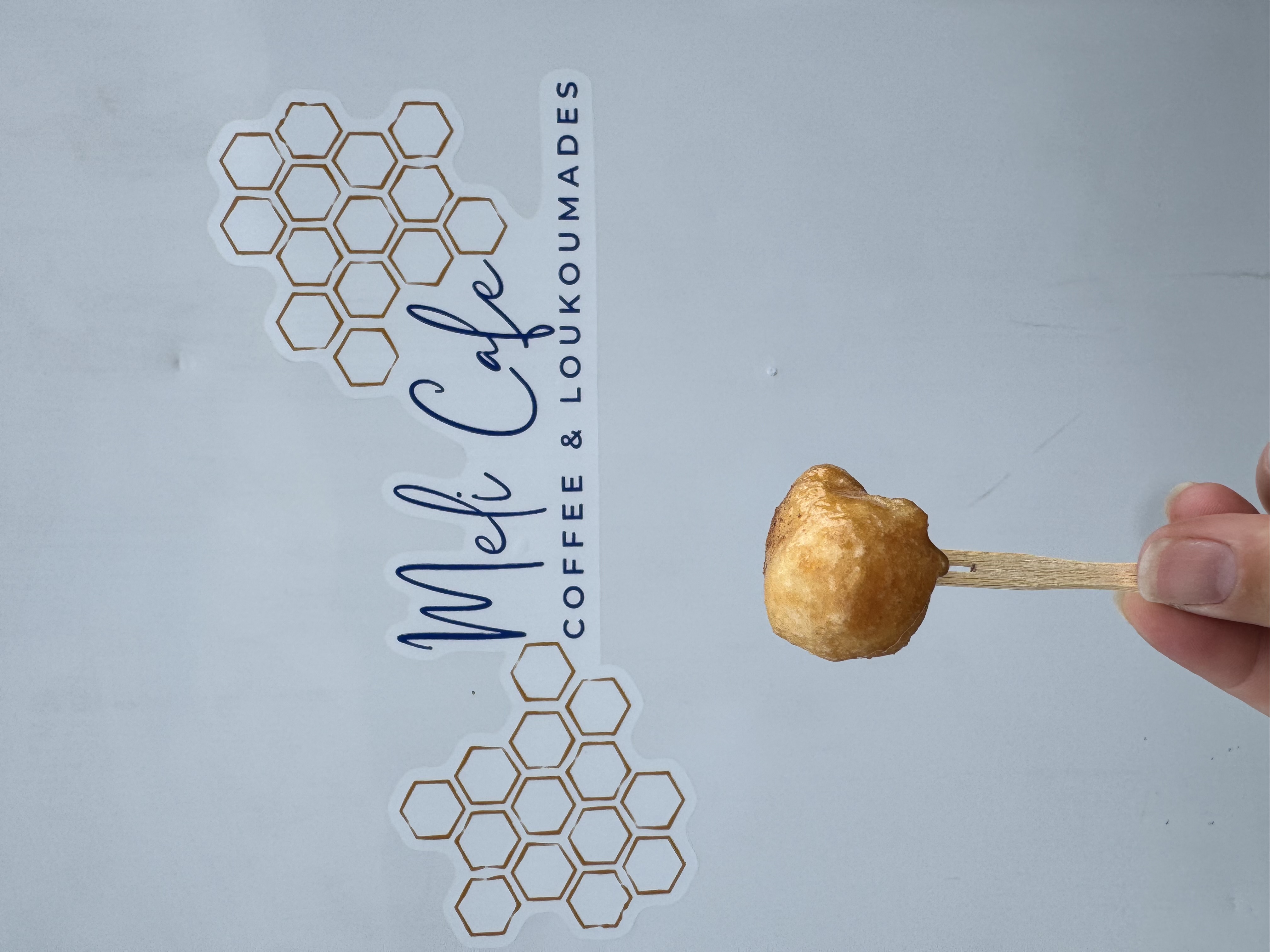 loukoumade with logo behind